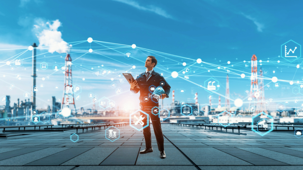 Un apporteur d'affaires dans l'industrie analysant des données numériques dans un environnement industriel connecté
